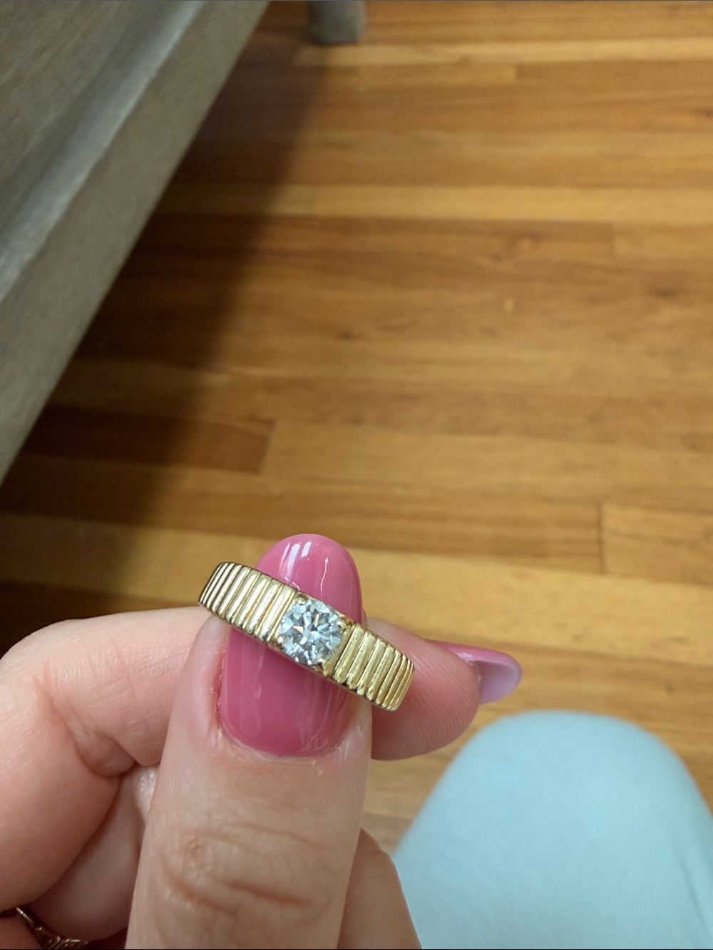Gold Ribbed Band Ring with Sparkling Center Stone